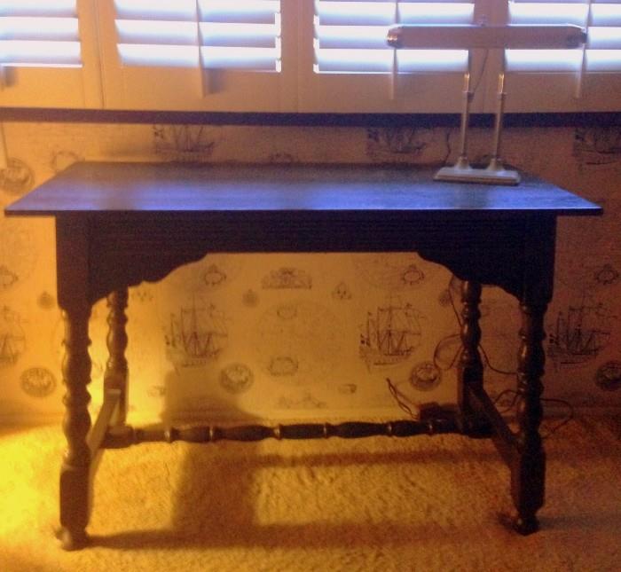 Nice and simple desk with a classic style and a rich, dark wood color!