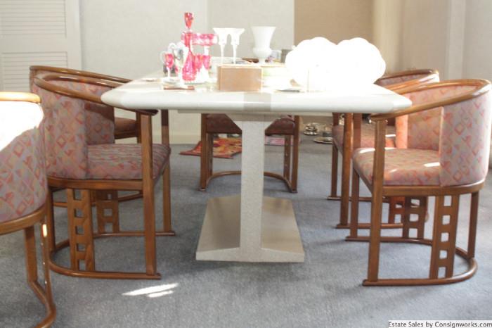 Contemporary dining table, seats 6. Has leaves to seat more.