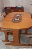 Mid Century Modern table with ceramic tile inlay. Table self-stores 2 leaves