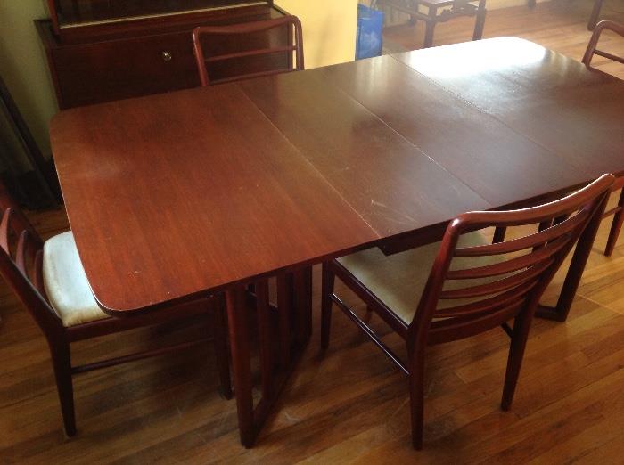 MCM Dining Table with 4 Chairs - comes with 5 leaves total.  Shown with two leaves in.