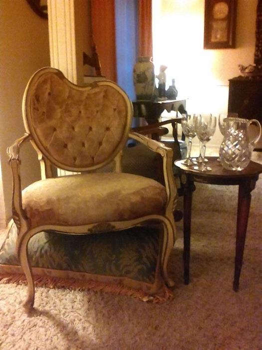 Beautiful antique Italian chair sitting alongside a precious crystal pitcher and glass ensemble ---what an elegant look!