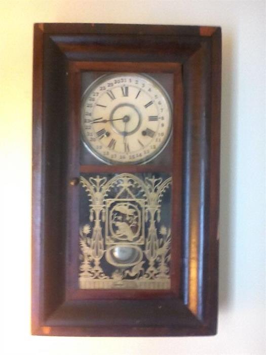 Great late 1800's wall 8-day calendar clock by Burns. May need some repairs, but has a great look. A key is inside.