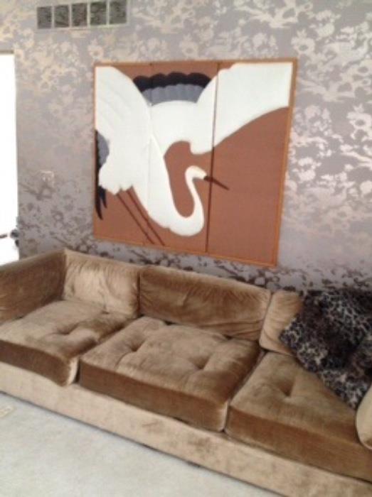 taupe couch and 3-panel fabric art