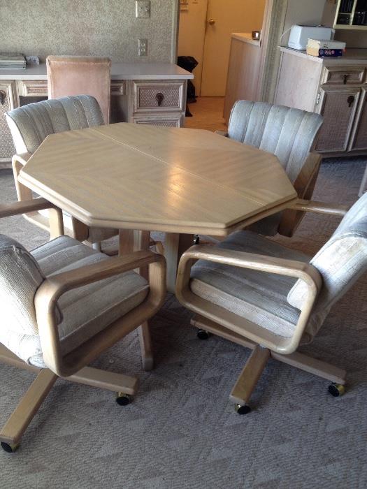 Octagonal Kitchen/Dining table with 4 chairs on casters - table also has an additional leaf