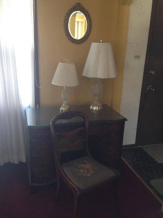 Antique desk, chair, wall mirror and glass lamps