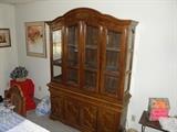 Roomy Lighted (2 lights)  Dining room hutch with glass shelves.