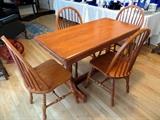 Cherry table and chairs made in Canada.   Leaf pops out and table opens up to 48".