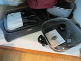 Rival electric skillet, Delonghi Perfecto lndoor grill, and a West Bend crock pot.