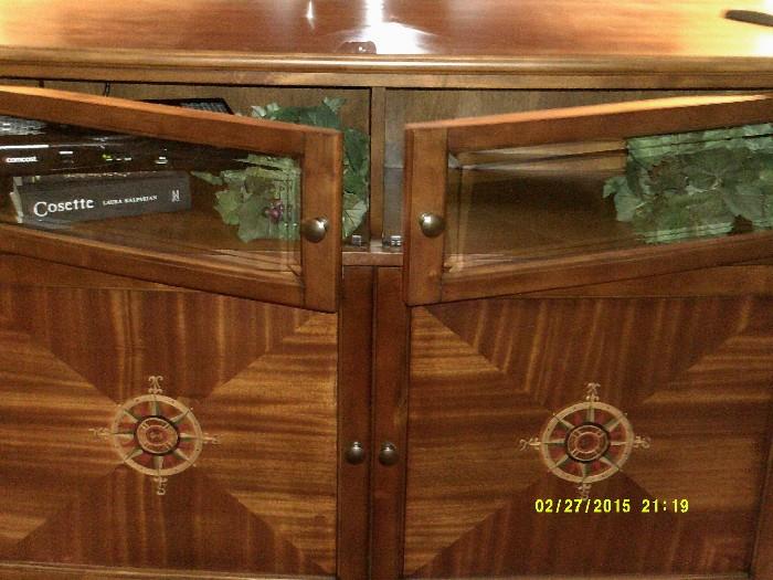Close up of TV console showing storage/display area---beautiful wood grains