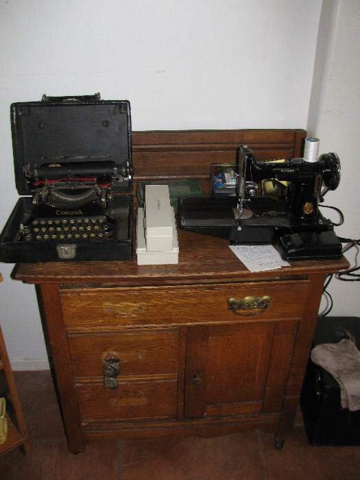 Very old typewriter, folds down to fit in carrying case! Singer sewing machine with case.