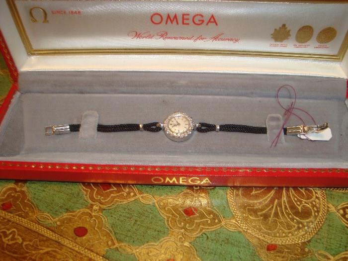 Omega ladies 14 kt gold watch