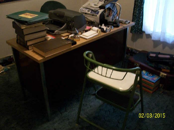 Metal desk, step stool/chair, books.