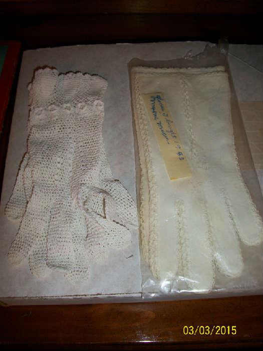 Crocheted gloves and pair of cotton gloves
