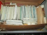 Box of postcards and travel guides