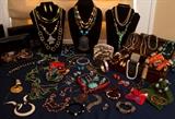 Large assortment of jewelry. Some sliver, and turquoise. Semi precious stones, pendants, bracelets, art glass beaded, earings, etc.