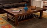 Asian influence, solid wood table with rattan inlay on center, magazine rack below. 36W x 59L x 17.5 H
