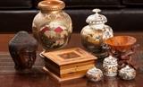 Assortment of small decorative items. Carved Ebony Budda head from Bali, Burl wood box, Asian painted wood canisters etc.