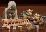 Native American Stone sculpture from Canada, Chinese carved snuff box, carved wood elephants, pair of ceramic glazed FooDogs from Taiwan etc.