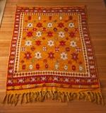 Moroccan Wool rug, saffron color with red, white and blue designs. Fringe on one end 52"x72". Just cleaned and in very good condition
