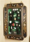 Asian inspired hanging curio cupboard. 4 opening side compartments