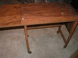 Small rolling table with drop down leaf
