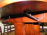 Drop leaf dinning table with three leaves and four chairs