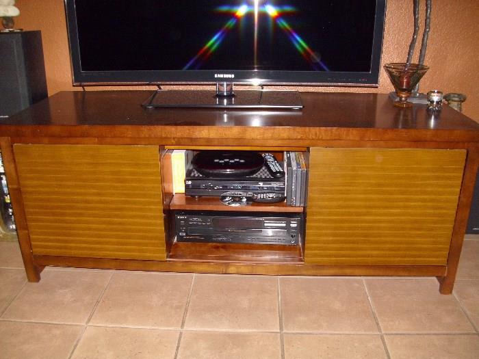 TV console with sliding front doors in good condition