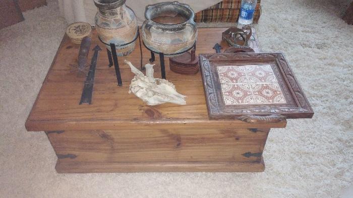 chest table and pottery 
