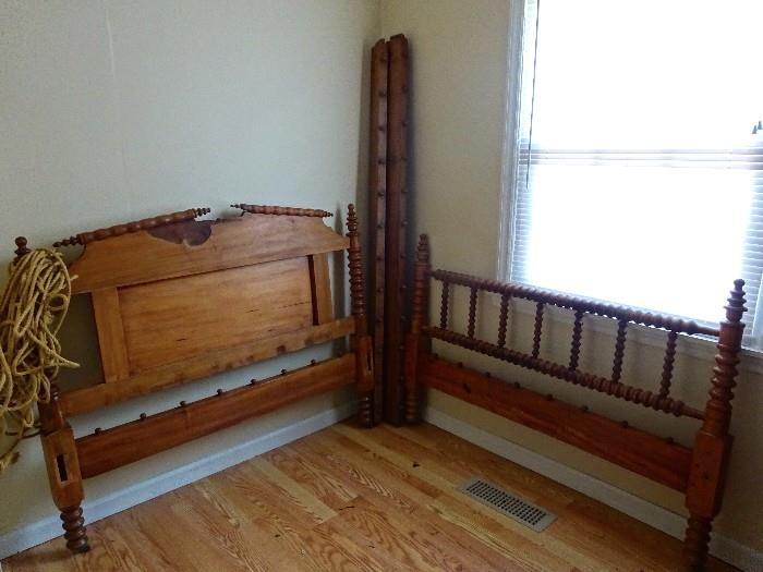 Antique solid wood rope spindle bed. Wooden sideboards and rope all come with this unique full size bed. 