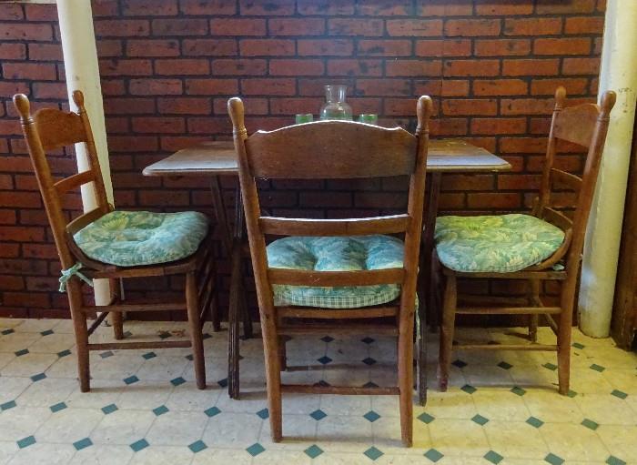 Primitive table with three chairs.  Great for that small room.  