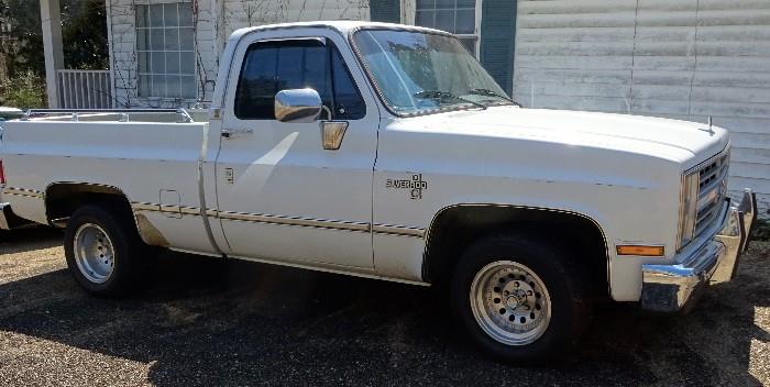 Side view 1985 Silverado Chevy Truck.  Good condition with 112,000.  Dual exhaust system with twin gas tanks and power windows. Interior in great condition. An excellent buy.