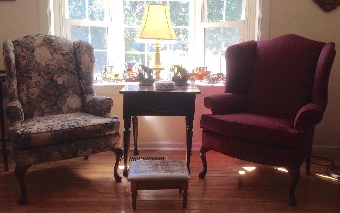 Floral and burgandy wingback chairs with queen anne legs.  