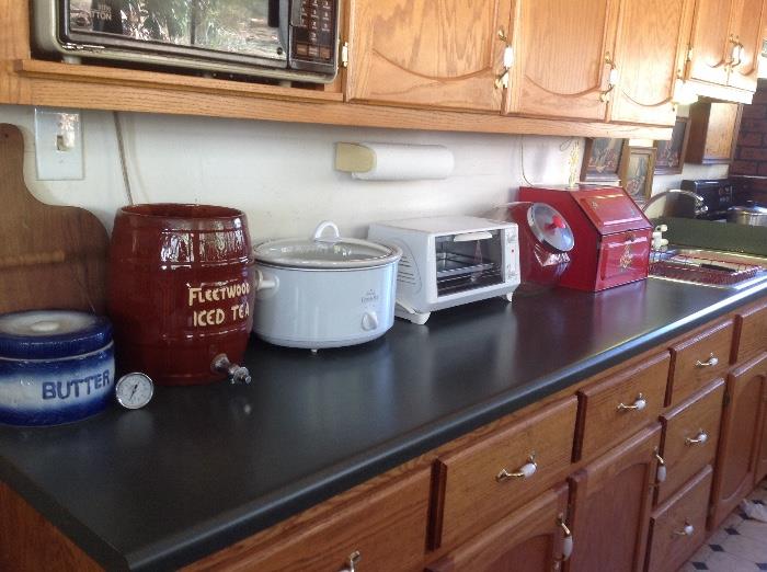 Large selection of small applicanes including microwave oven, crock pot, toaster over, vintage red bread box, cookie jars, George Foreman Grille still in the box and many more items still in the box.  