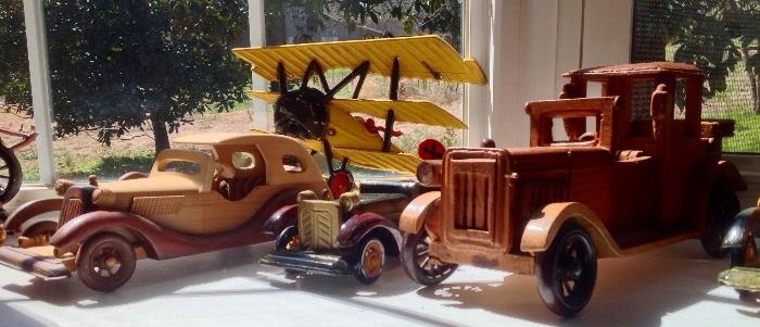 A collection of metal and wooden cars for the enthusiast who collects these precious items.