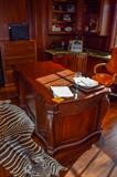 Desk three sections of leather writing surface.$2200 . Zebra is not for sale. Three drawer file cabinet in background