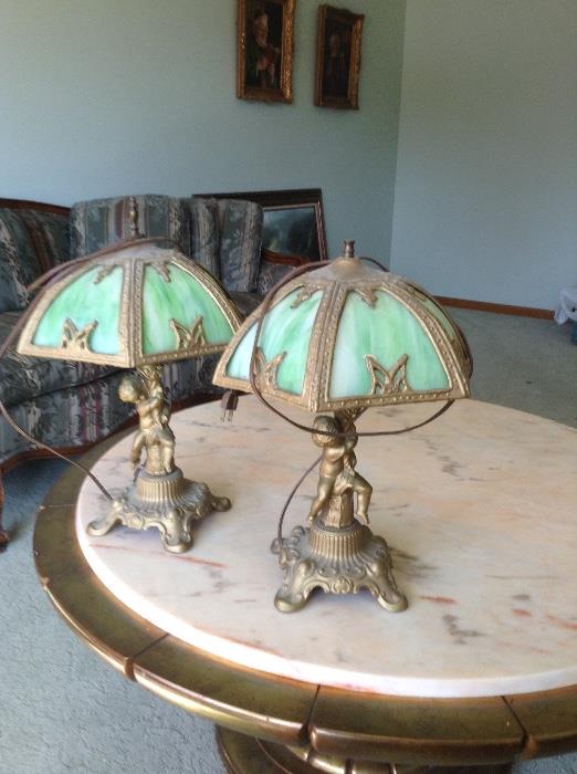 Vintage cast cherub lamps with original tiffany style shades 