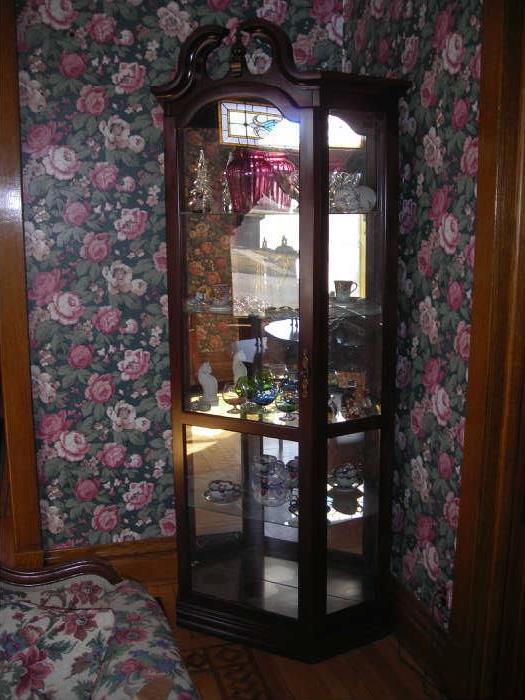 curio cabinet with glassware