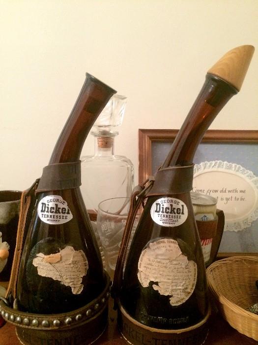 Vintage Dickel bottles, one with wooden stopper, both with leather handles