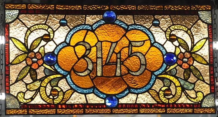 STAINED GLASS ADDRESS WINDOW W/ JEWELS, "3145". MEASURES APPX. 17" TALL BY 32" WIDE.