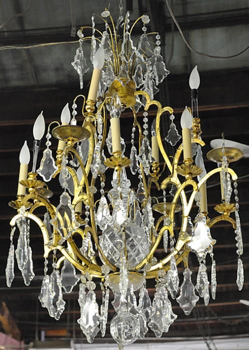LARGE CHANDELIER WITH BEAUTIFUL CRYSTALS. FRENCH LOUIS XIV STYLE. MEASURES 42" LONG, AND MEASURES 30" IN DIAMETER.