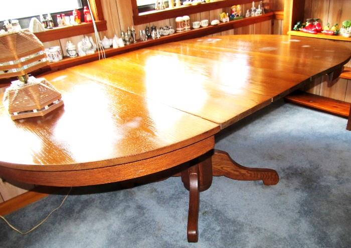 Vintage Oak Dining Table with beautiful natural oak finish,  Pedestal Base,  3 Extra Leaves.  Beautiful Table; There are also 4 Vintage Matching High Back Ladder Back Oak Dining Chairs with natural finish,  as well as a Set of 6 Vintage Matching low back ladder back chairs ...all  are pictured elsewhere in this collection 