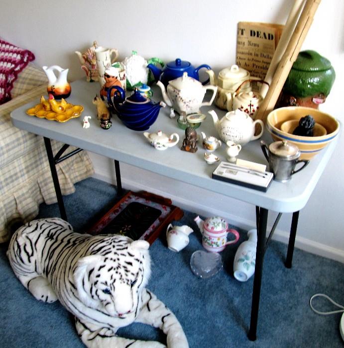 Collection of Teapots...Asian, English, American ...some vintage.including the Aladdin Teapot by Hall; Other items displayed including the large stuffed tiger are also available.
