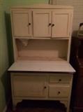 Antique Hoosier-style free-standing kitchen cabinet with flour sifter.