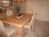 Dining Room table is 64 inches long x 42 inches wide, 1 leaf = 18 inches plus 4 chairs.