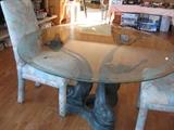 Glass top table with fish base and 4 upholstered chairs