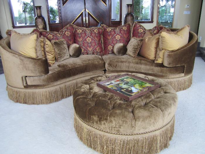This outstanding velvet sofa is over 10' long. The ottoman measures 48" round.