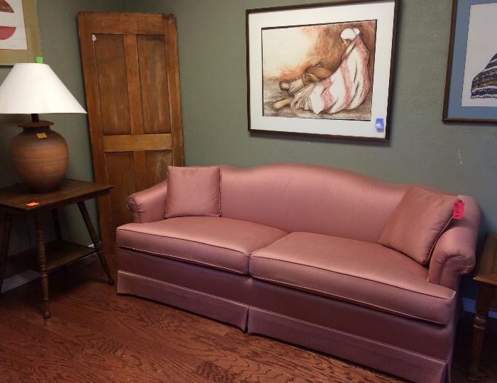 Ethan Allen rose pink sofa, pottery lamp, RC Gorman signed and numbered lithograph, antique oak square table.