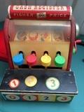 Several old Fisher Price toys in unbroken but played with condition.