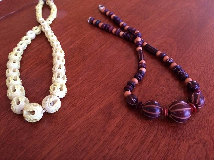 Celluloid or Bakelite Necklaces.  Passed Hot water and chrome polish tests.