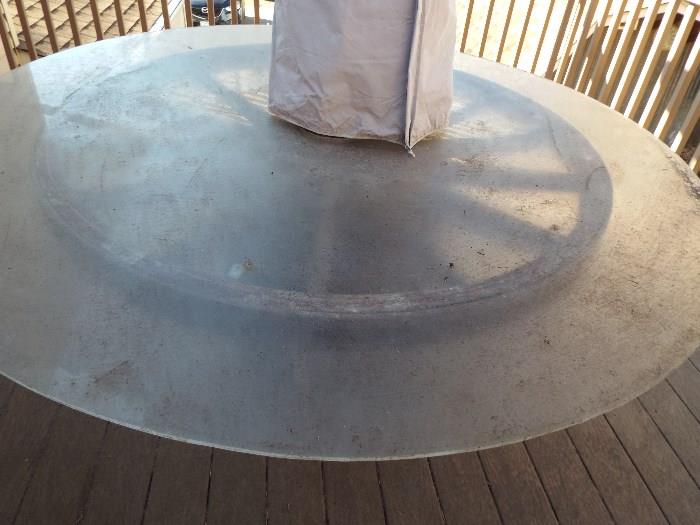 Wagon wheel with wine barrel bottom with umbrella. Once we get the table cleaned it will look great.